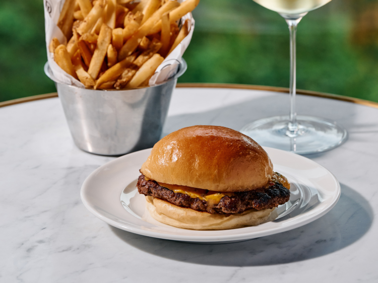 Sit on the terrace at French restaurant Maison Bâtard