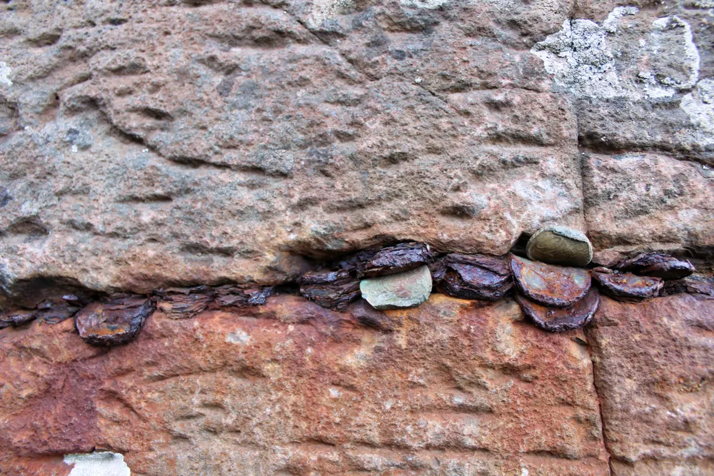 Aged, discoloured coins at Giant’s Causeway in Northern Ireland