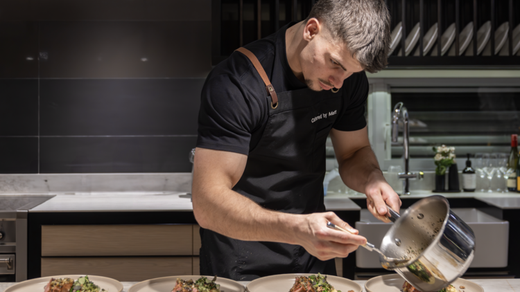 Catered by Matt plating up meals