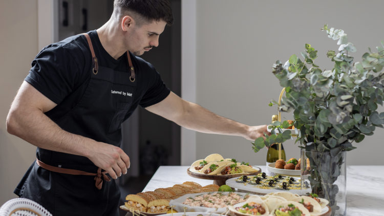 Catered by Matt plating up meals