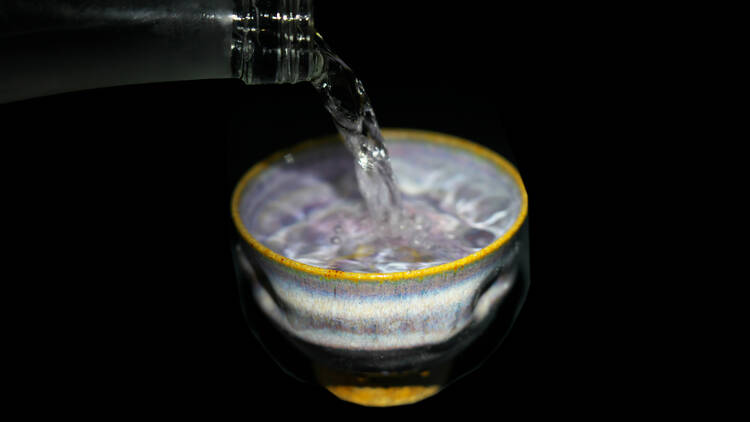 Stock photo of shochu being poured into a cup