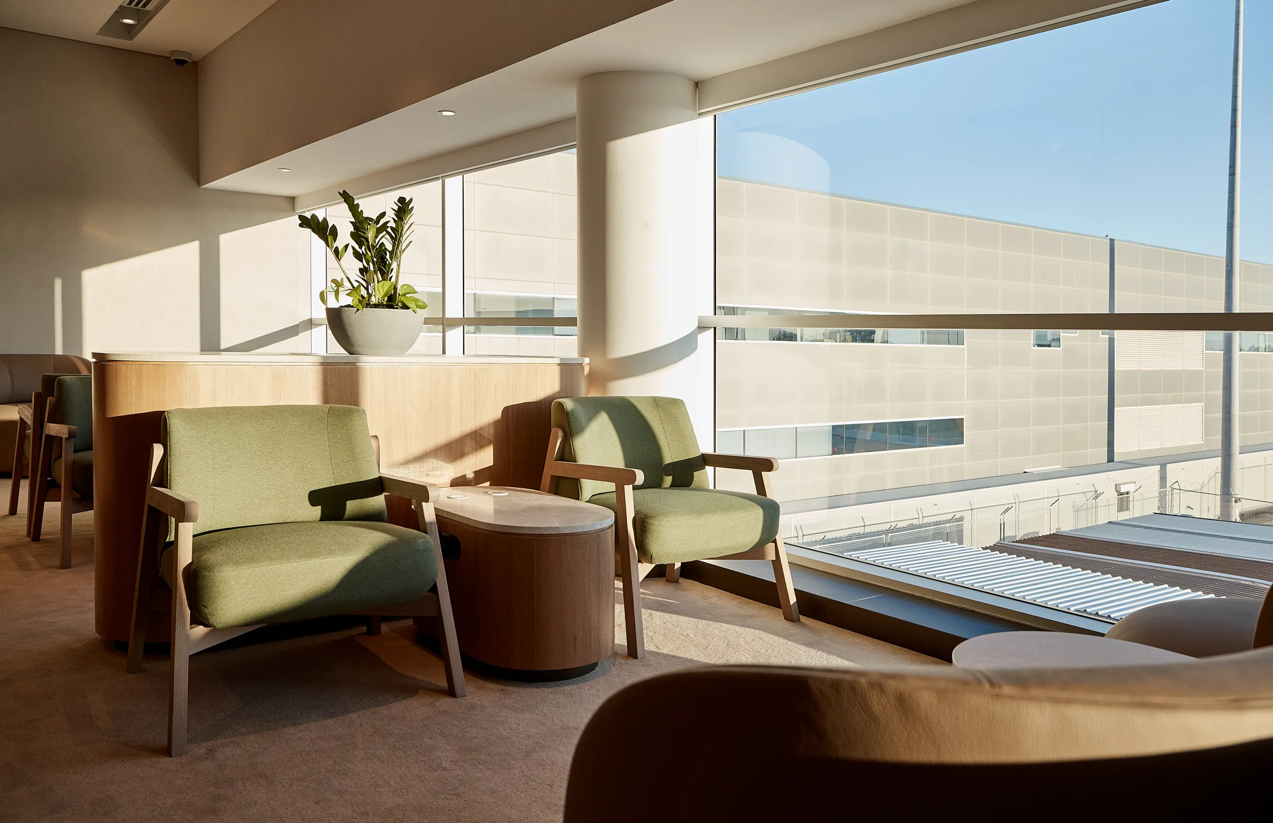 Two green chairs at airport lounge