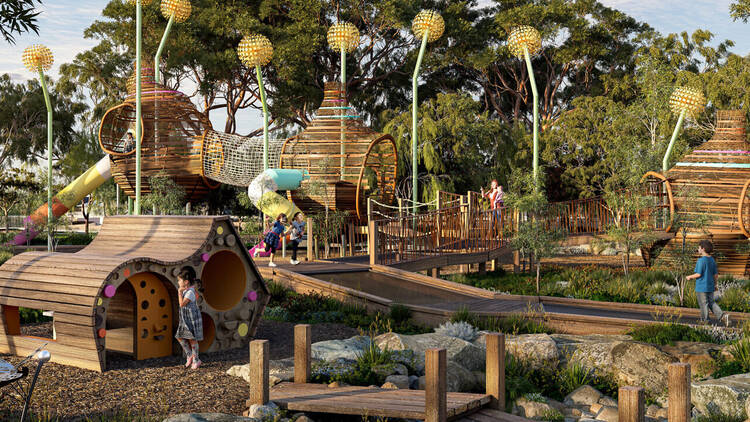 A huge playground with timber structures and colourful accents. 