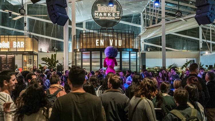 A drag queen on the central stage at Time Out Market Barcelona