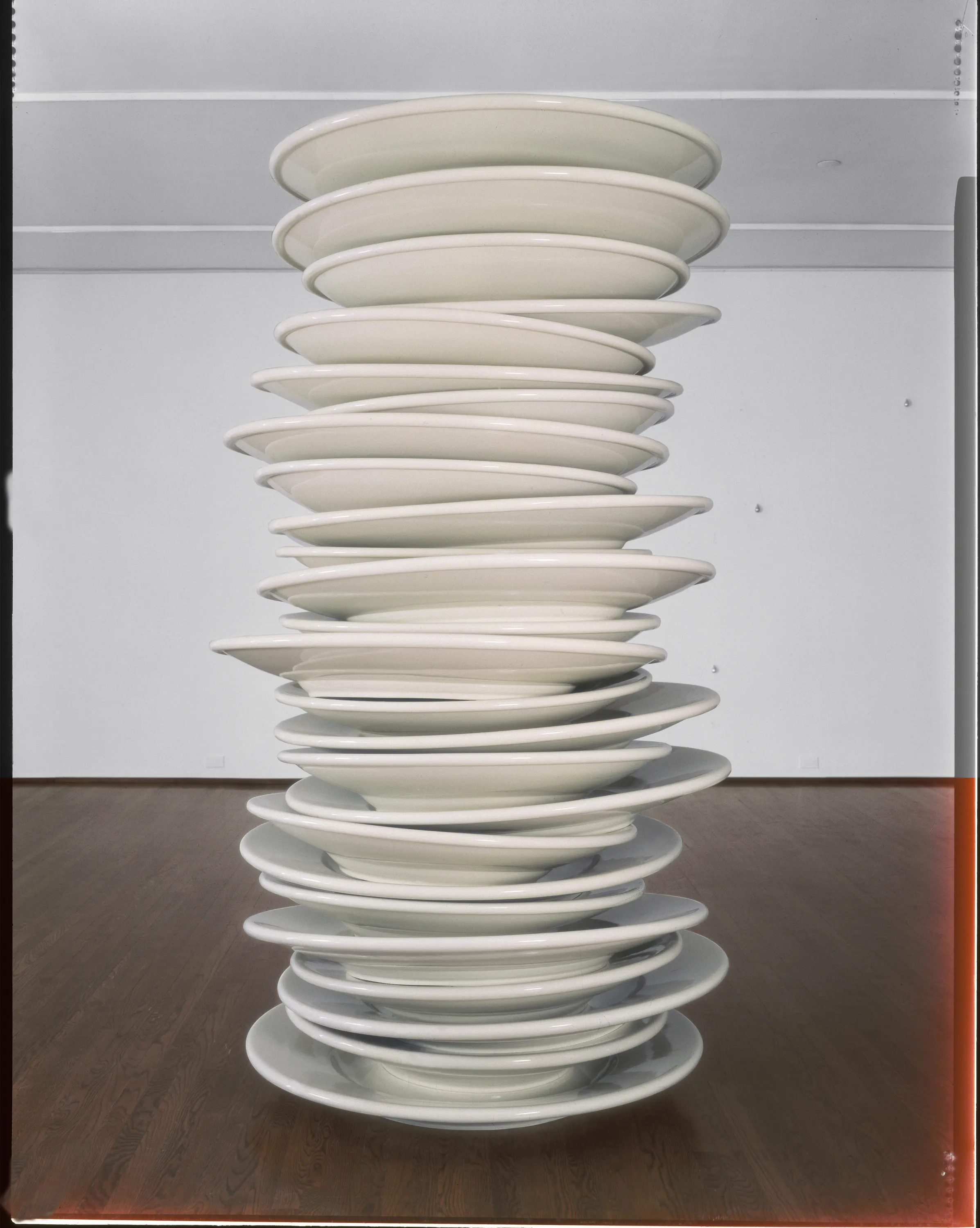 A sculpture of a stack of oversized dinner plates.