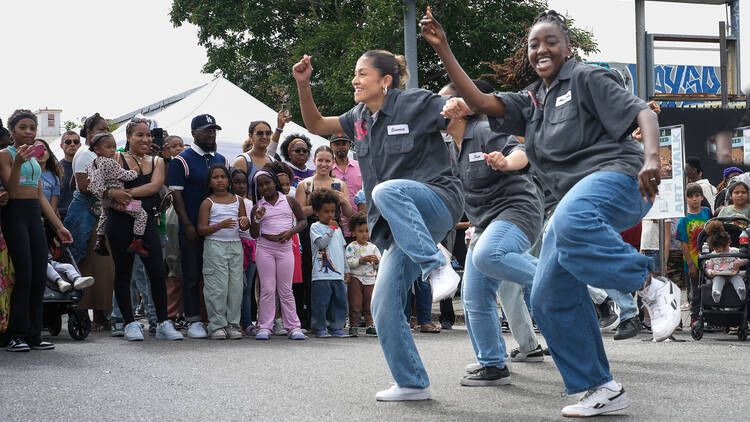 Debbie Allen Dance Academy Community Block Party Four women dance for a crowd at the Debbie Allen Dance Academy Community Block Party.