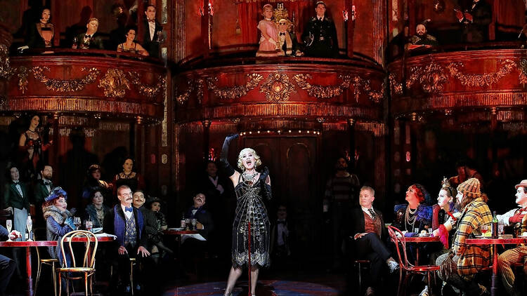 Woman singing opera on a bohemian set