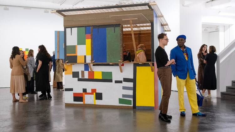 London Gallery Weekend 2024 Ten people stand around looking at an exhibition at Goodman Gallery during London Gallery Weekend 2024