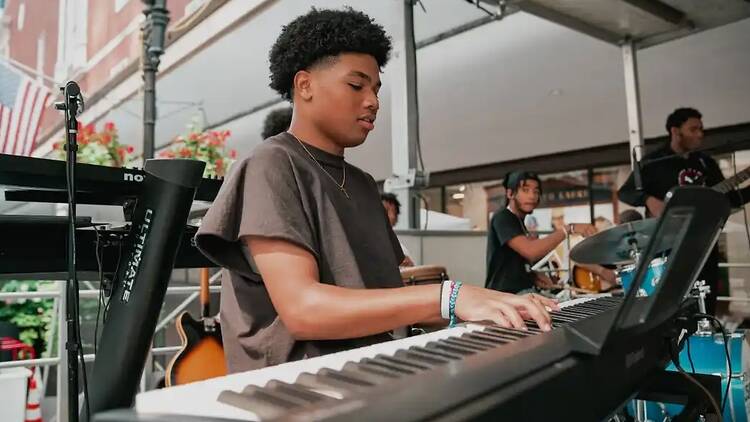 young man playing piano
