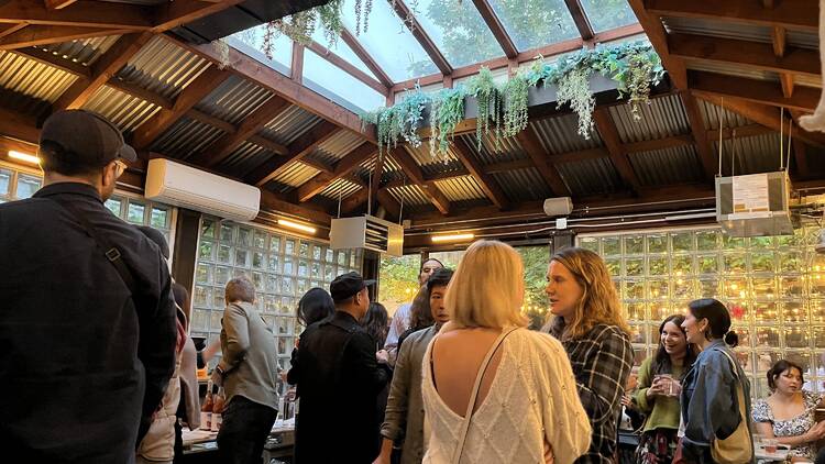 Peope standing under a skylight