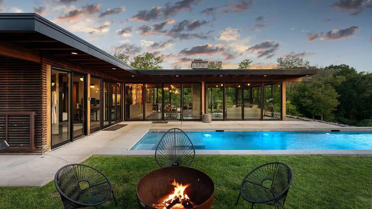 Modern glasshouse with pool in Hudson Valley