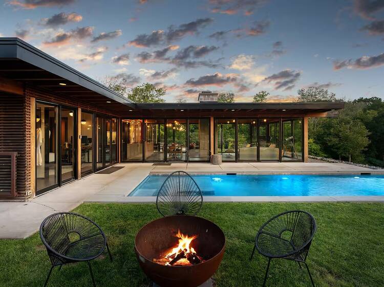 Modern glasshouse with pool in Hudson Valley