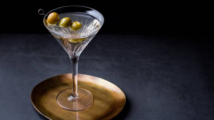 Dirty martini with olive garnish