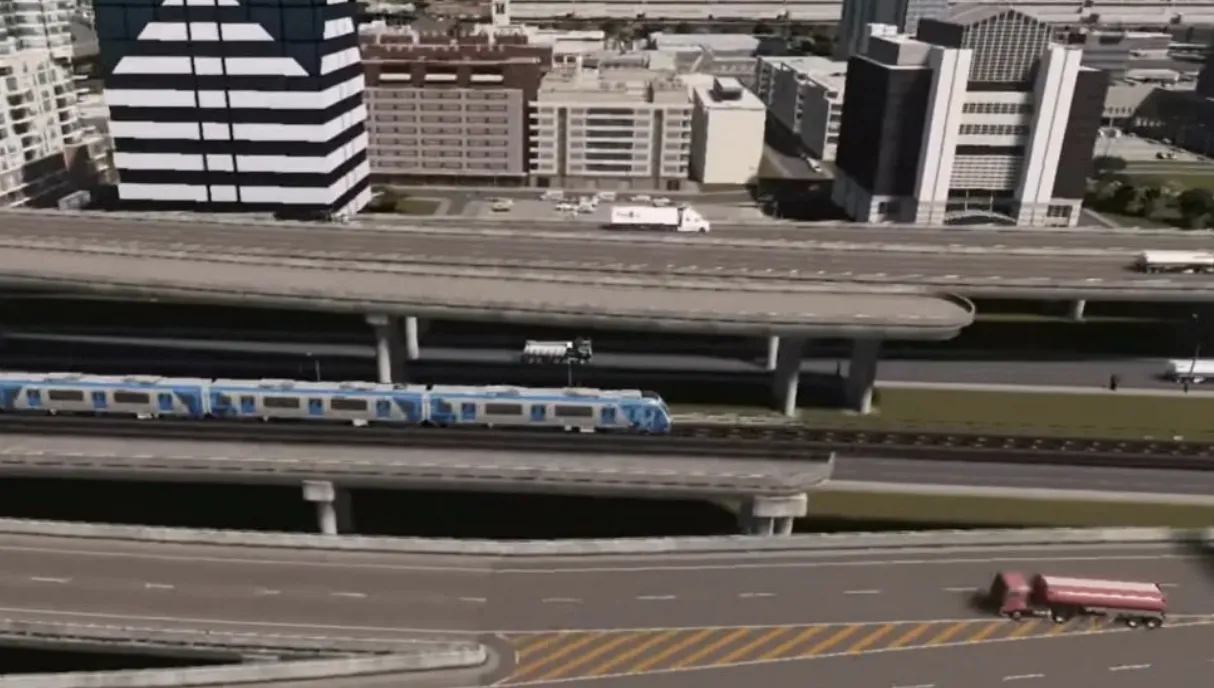 Train line on unfinished freeway