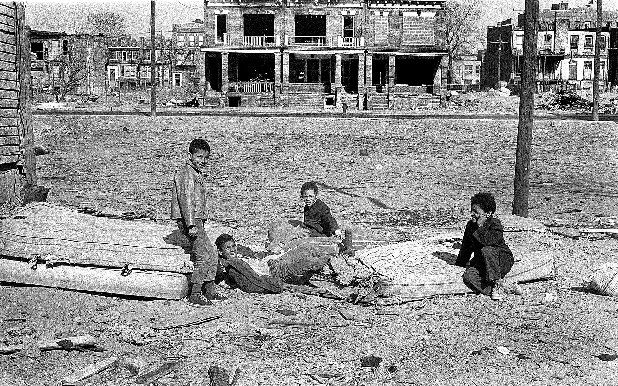 Kids playing on mattresses, West 32nd Street, 1969