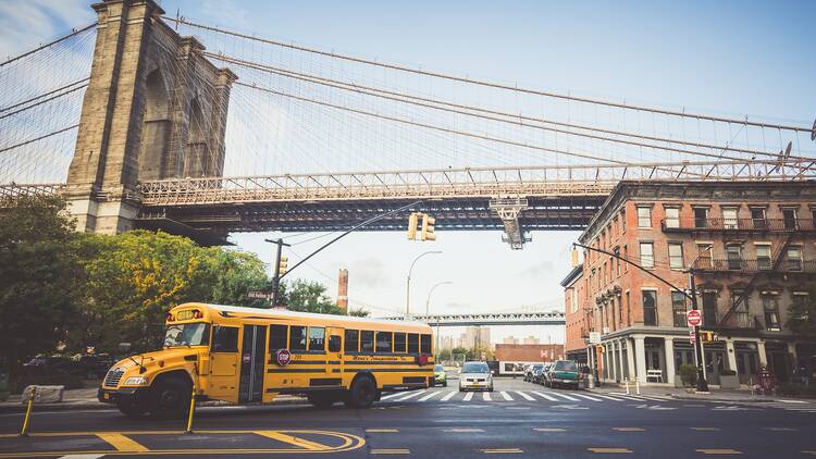 School bus under the Brooklyn Bridge