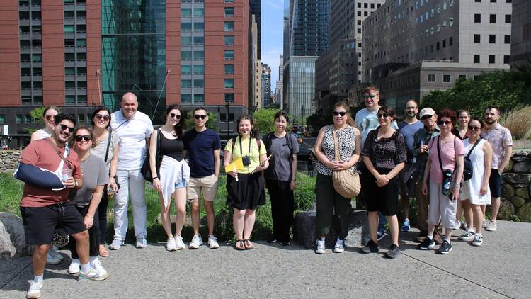 A tour group poses for a photo in Lower Manhattan.