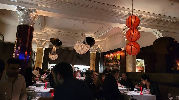 A dining room with interesting light shades