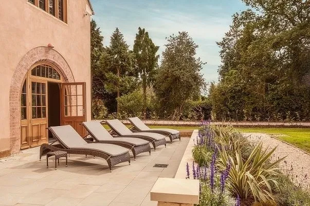 The front entrance, driveway and manicured gardens of Mallory Court Hotel and Spa, in Leamington Spa, Warwickshire.