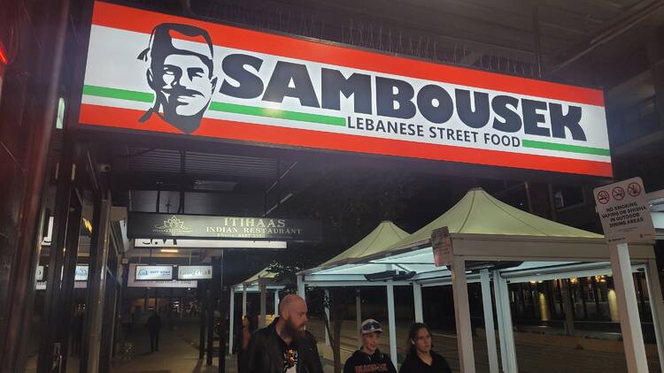 A sign that says SAMBOUSEK LEBANESE STREET FOOD