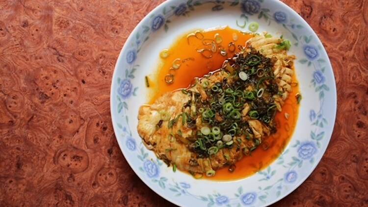 A dish with scallions and chili oil