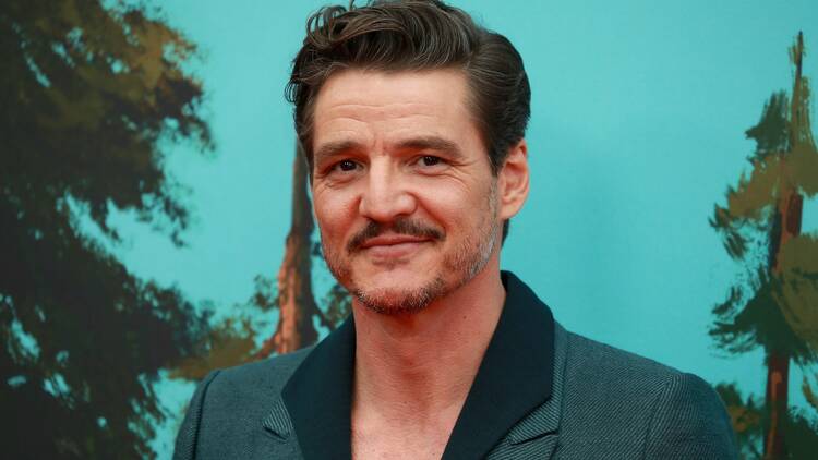 Pedro Pascal with a blue background