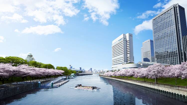 Hotel New Otani Osaka and boats on the Daini Neya River