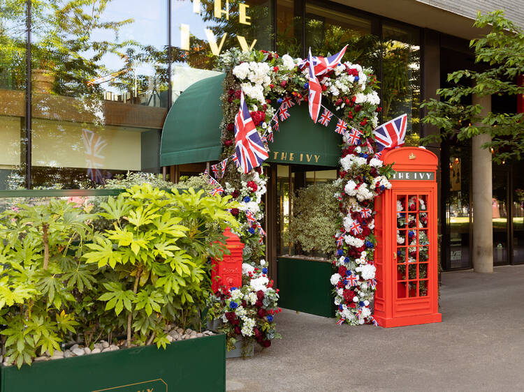 the ivy restaurant london front entrance with floral arrangement 