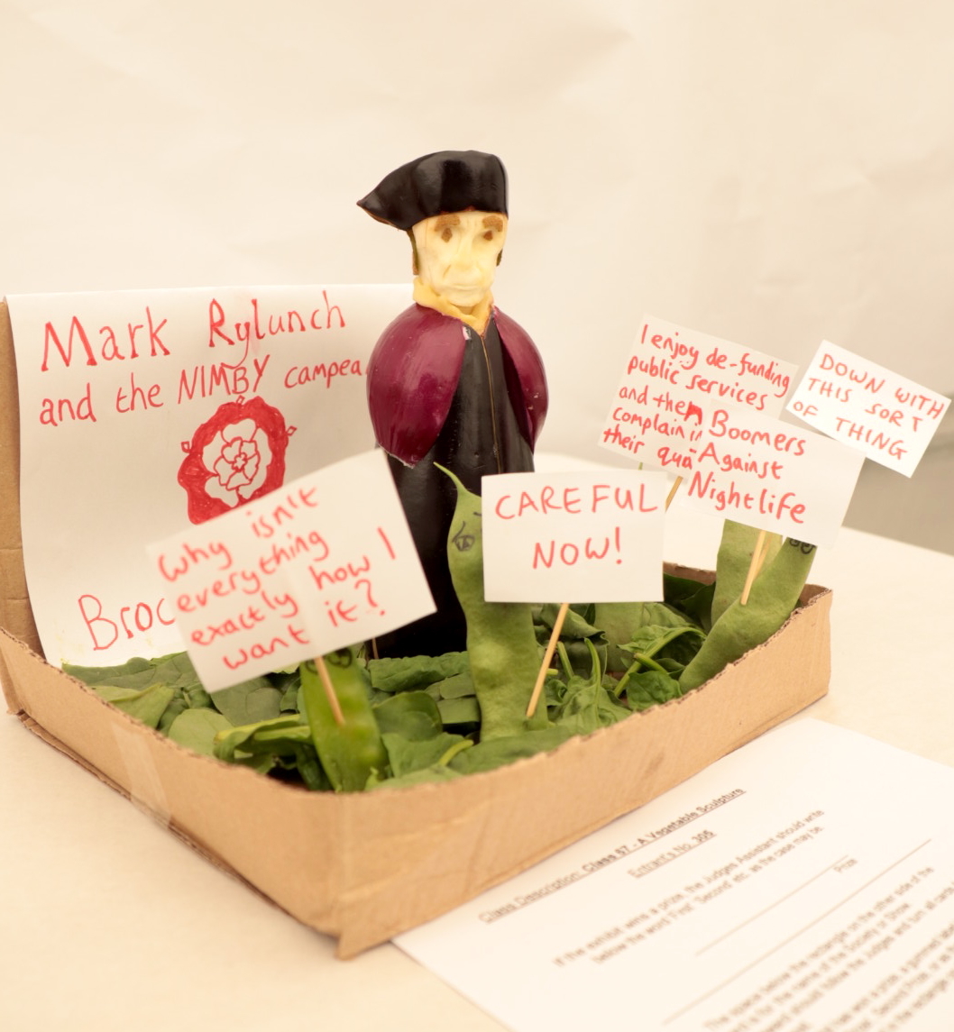 Vegetables depicting Mark Rylance with protest signs 
