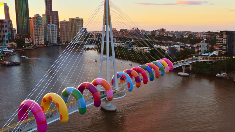 Inflatable sculpture around bridge