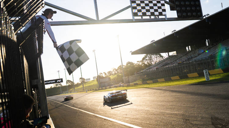 Waving the race flag for a Ferrari at Sydney Motosport Park race track