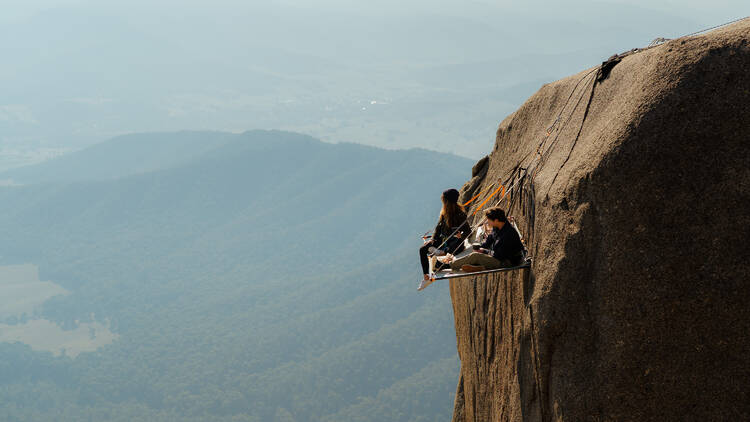 Couple abseiling