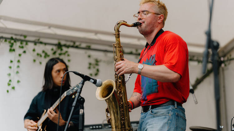 Man playing a saxophone at Rhythm & Taste Man playing a saxophone at Rhythm & Taste