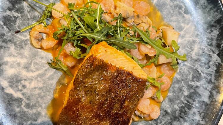 Chalk stream trout in a shellfish cream broth at The Limelight Club