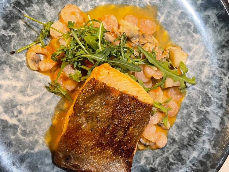 Chalk stream trout in a shellfish cream broth at The Limelight Club