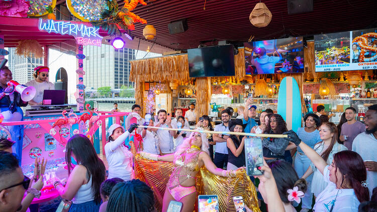 People play a limbo game.