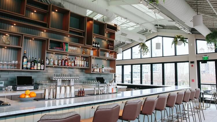inside of a roofdeck wtih a bar inside of a roofdeck wtih a bar