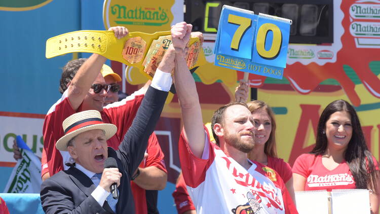 Joey Chestnut competing in the Nathan's Famous Fourth of July Hot Dog Eating Contest