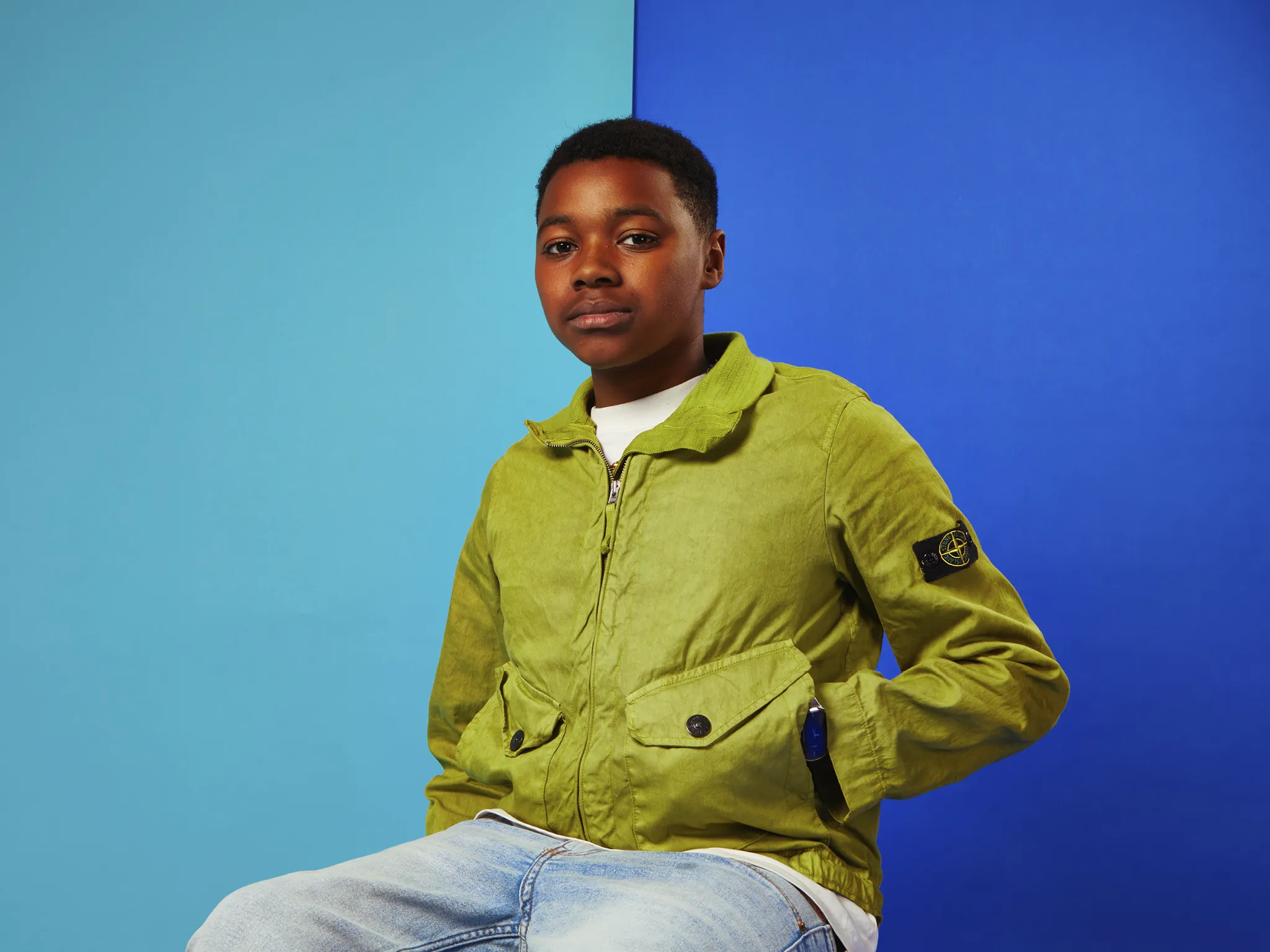 A Gen A wearing green jacket