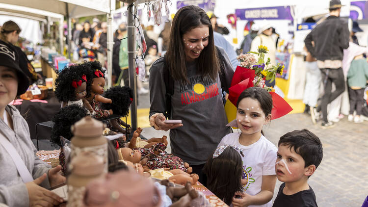 Mum and kids at a market stall