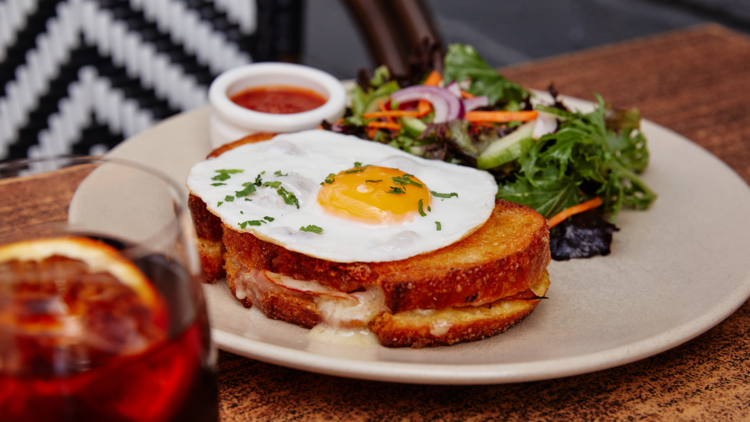 A sandwich with a fried egg at Bitton