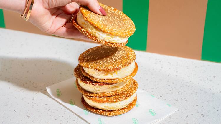 A stack of four ice cream sandwiches on a napkin