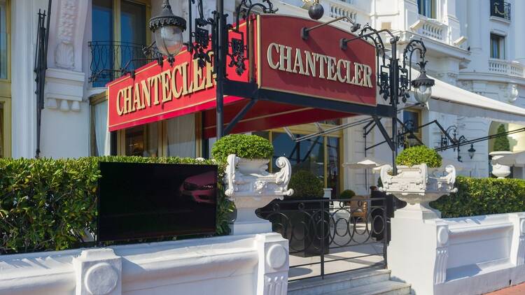 the facade and entrance of the famous Chantecler restaurant at the Negresco hotel in Nice on the Promenade des Anglais