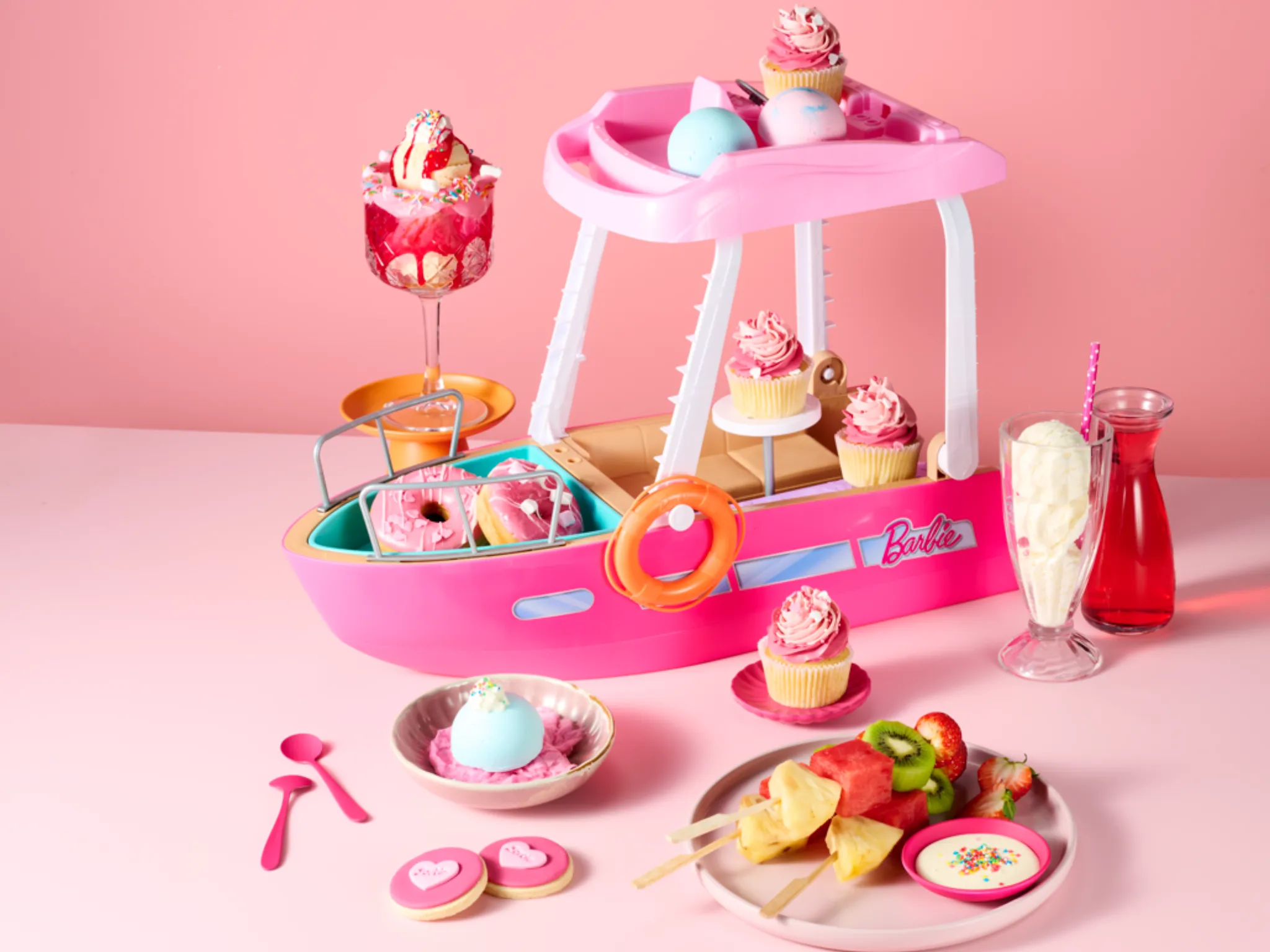 Elaborate display of Barbie-themed treats.