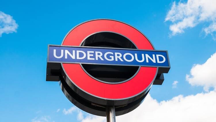 London Underground sign against a blue sky