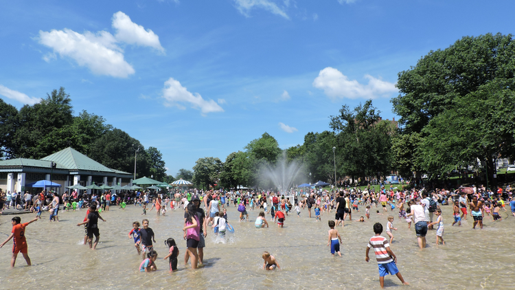 Kids playing in an outdoor spray pool Kids playing in an outdoor spray pool