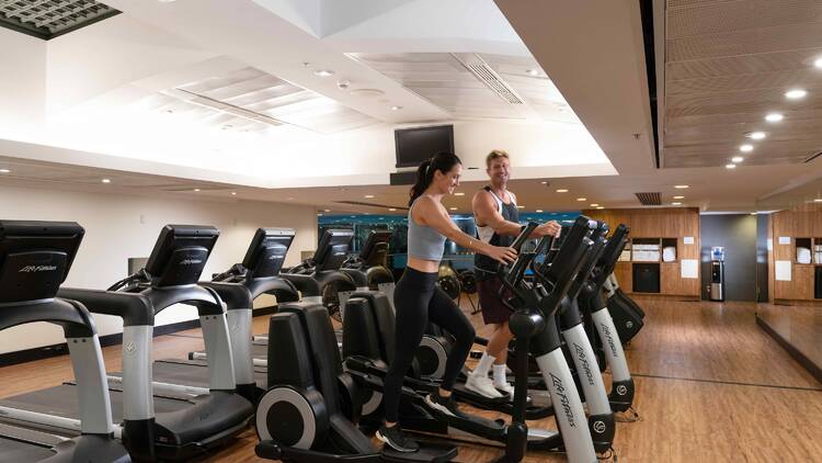 Couple on fitness equipment