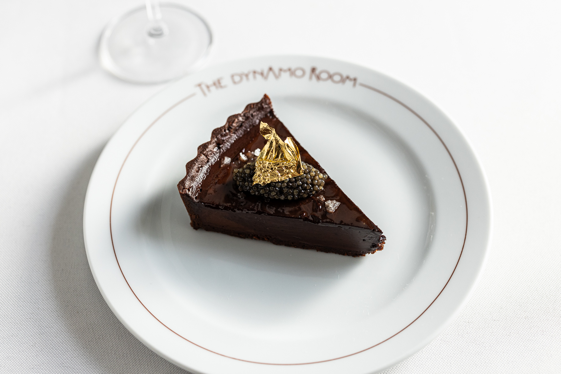 | Chocolate Tart that comes with caviar and gold leaf.