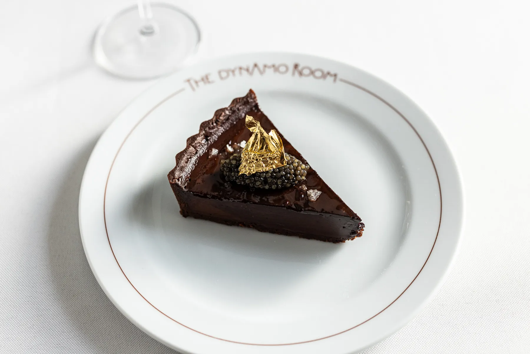 | Chocolate Tart that comes with caviar and gold leaf.