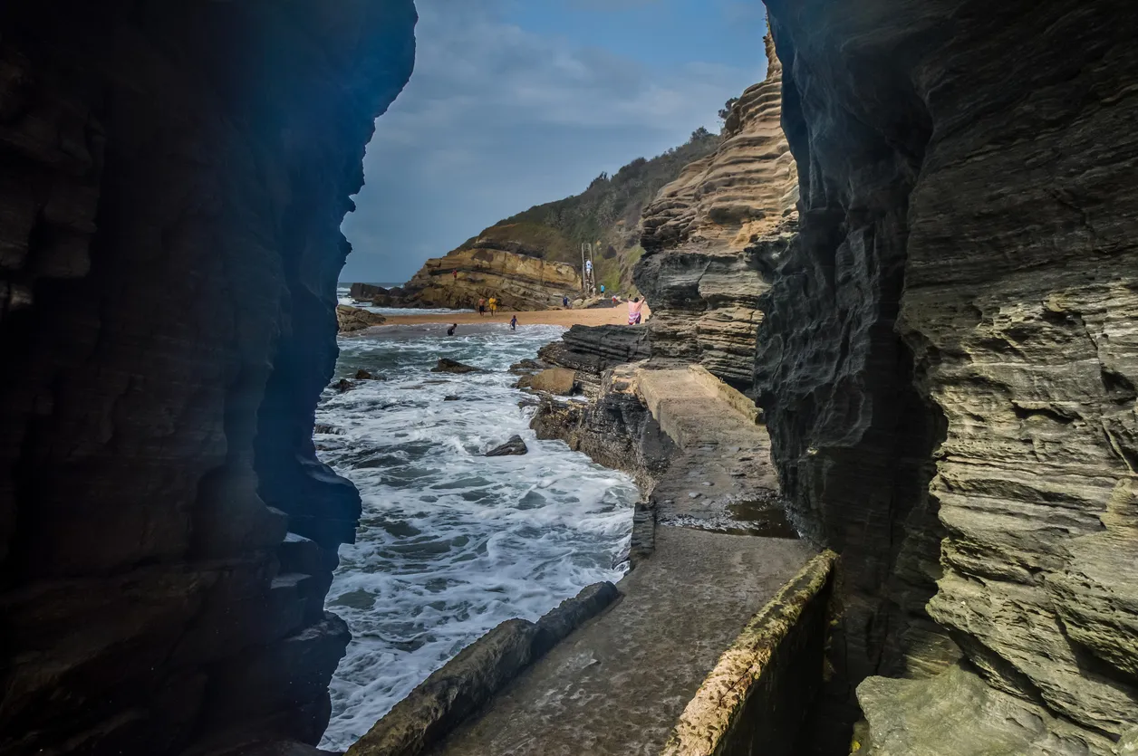 Hole in the wall natural rock formation at Thompsons bay beach ballito